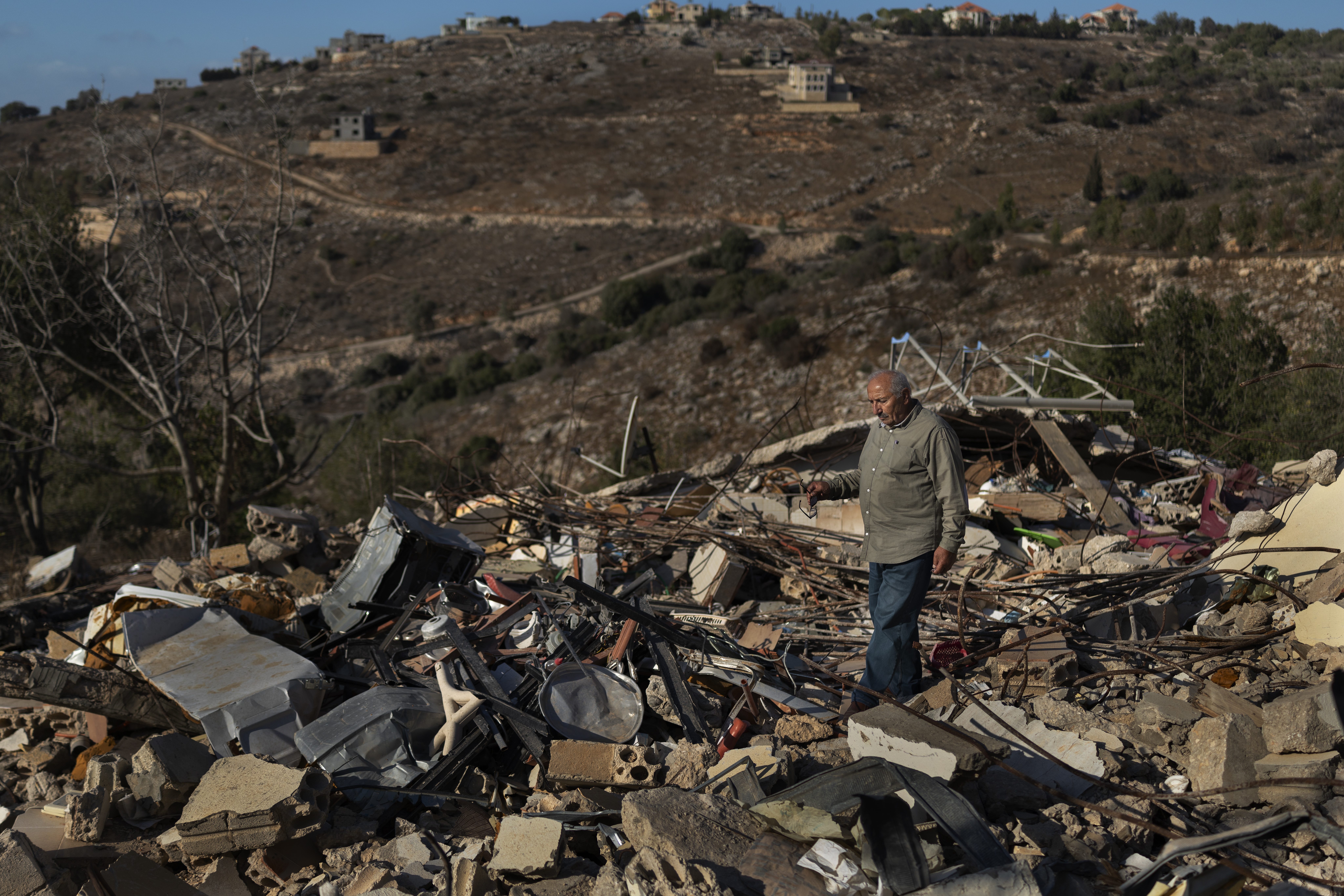 Abdul Aziz Chreim at his destroyed home in Houla, Lebanon, on Sept. 26. His house, along with those of his relatives, was destroyed during the Israeli occupation following the ceasefire.